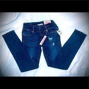 Distressed denim mid-rise skinnies